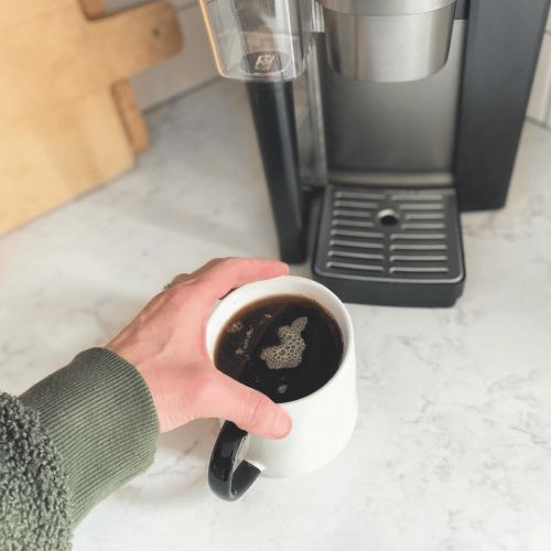 k cup coffee in a mug by coffee maker