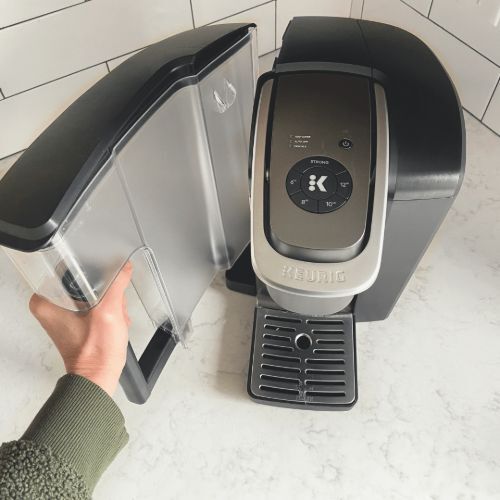 hand holding the water reservoir of a Keurig® coffee maker