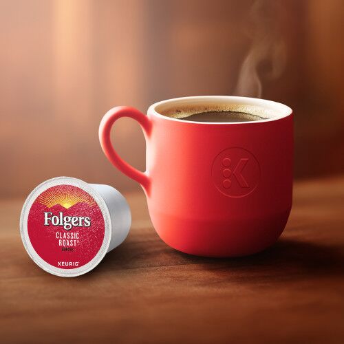 folgers classic roast kcup next to a red mug filled with coffee