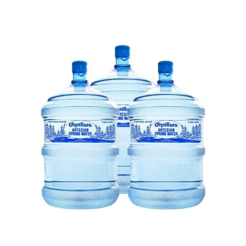 Three 5-gallon bottles of Distillata Artesian Spring Water.