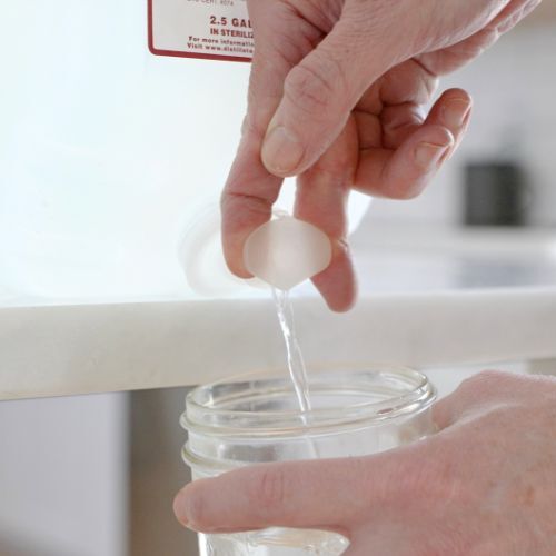 getting water from the spigot of a 2.5 gallon water bottle